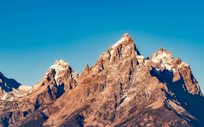 Mountain range with blue sky in the background