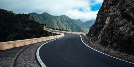 Winding road leading to mountains